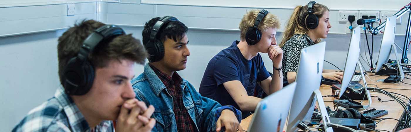 Row of students in the electroacoustic building's computer cluster