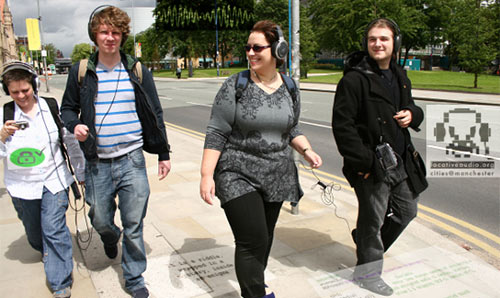 Students walking around campus with audio guides